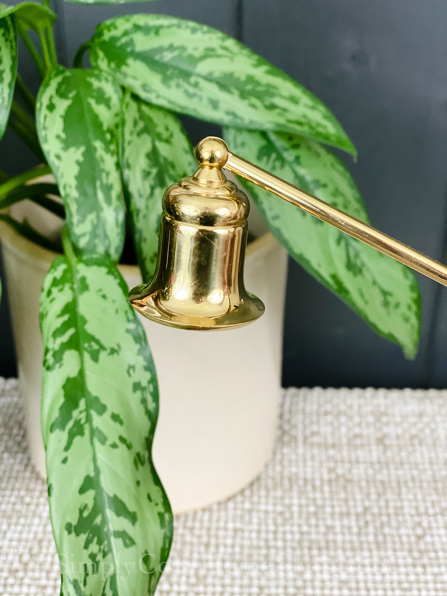 Small brass candle snuffer